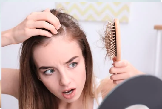 Girl realises hair is falling out.
