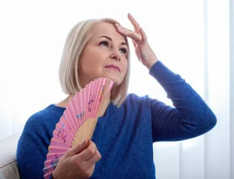 Lady with Fan - having hot flashes / flushes