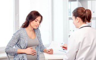 Menopausal woman talking to doctor