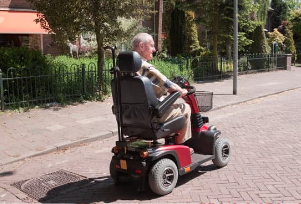 Gentleman on Senior Citizen's Electric Mobility Scooters
