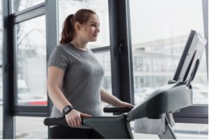 Anxious girl on treadmill - wondering How To Treat Anxiety Disorders