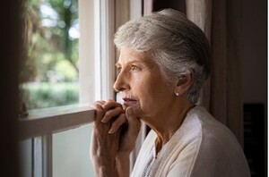 Older lady with Yeast Infection sitting ast window