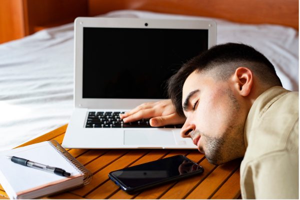 Man asleep at computer