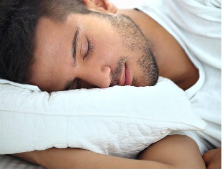 Man sleeping on side to stop snoring